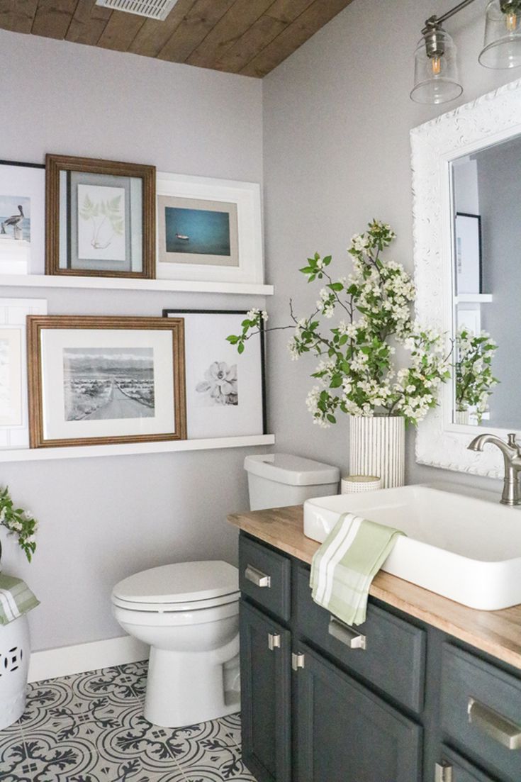 Bathroom with Many Paintings